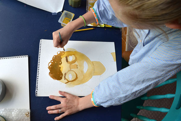 painting portraits of their dad for Father's Day