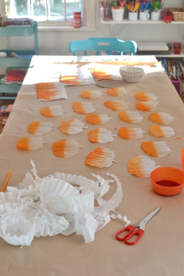 make this light and cheery pumpkin garland from coffee filters