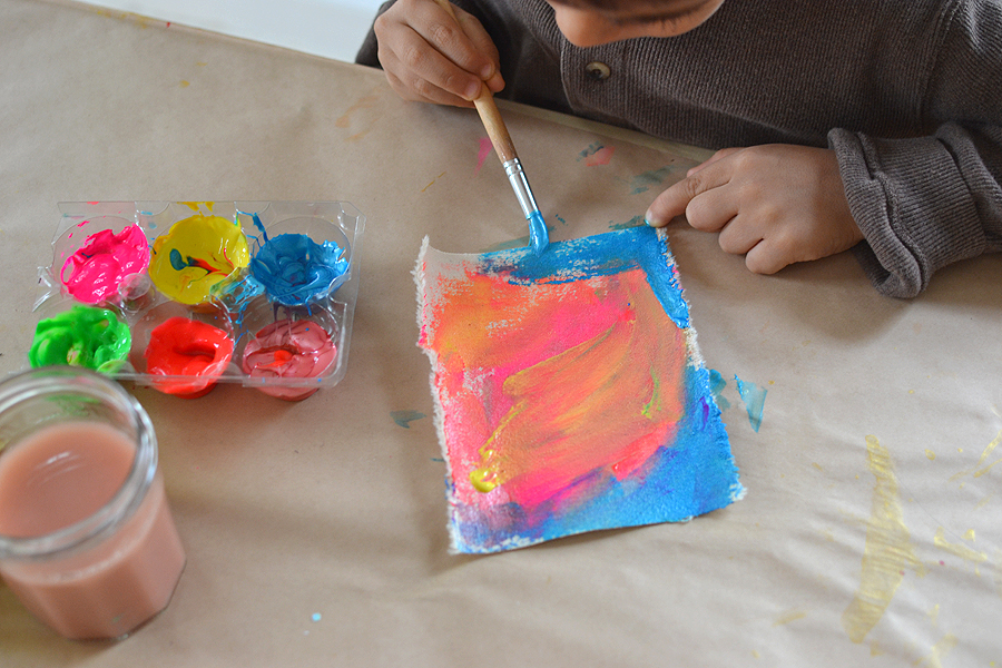 kids love painting on new materials ~ here kids use tempera paints to create little works of art