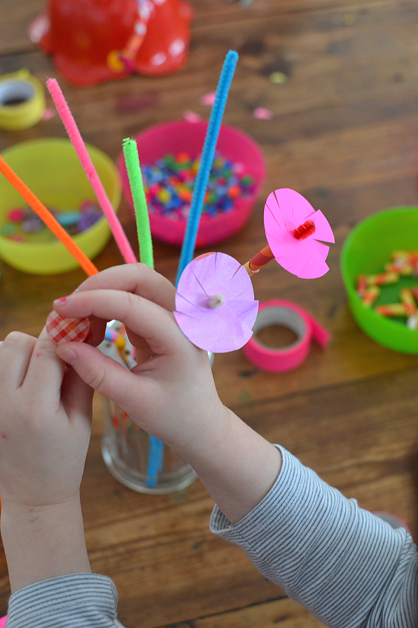 kids make a bouquet of pipe cleaner flowers with beads, buttons and paper