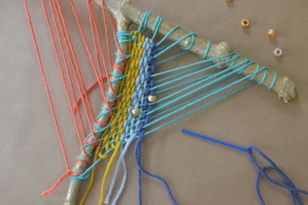 make a beautiful weaving from an ordinary branch