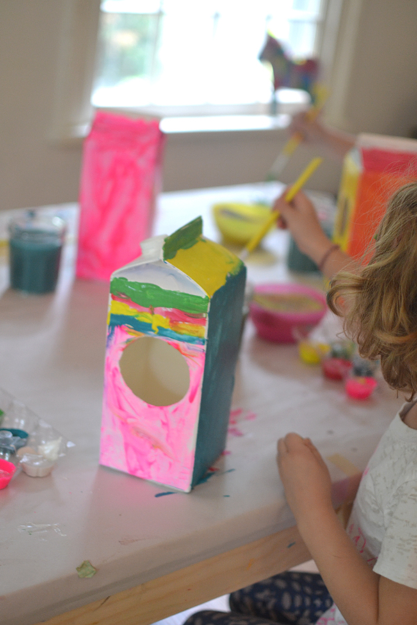 kids make this simple bird house craft from milk cartons