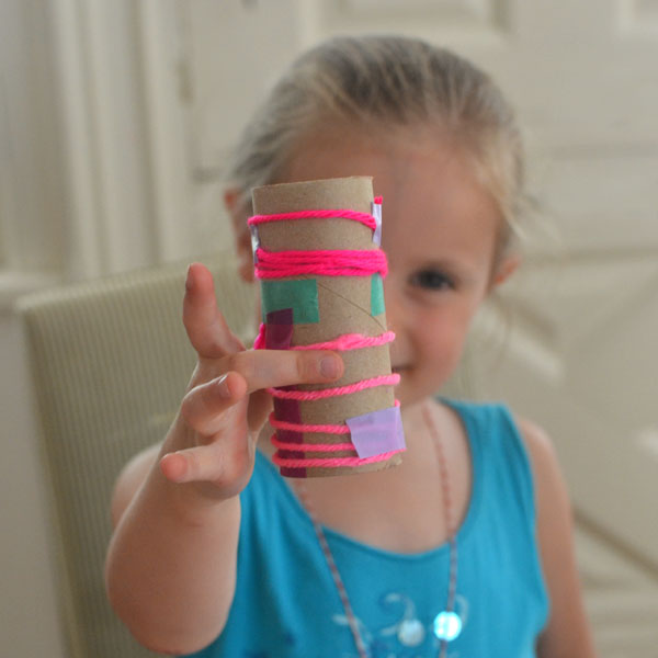 kids make this simple binocular craft with yarn and colored tape