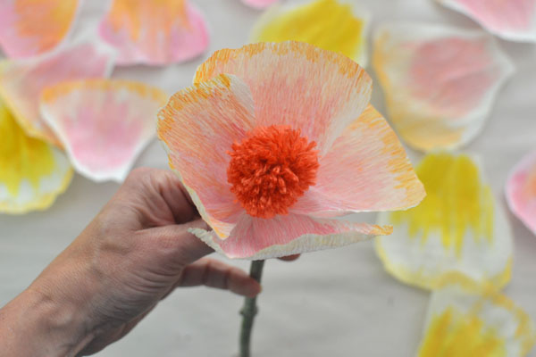 handmade flowers with crepe paper and pom-poms