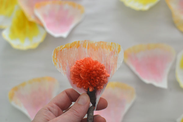 handmade flowers with crepe paper and pom-poms
