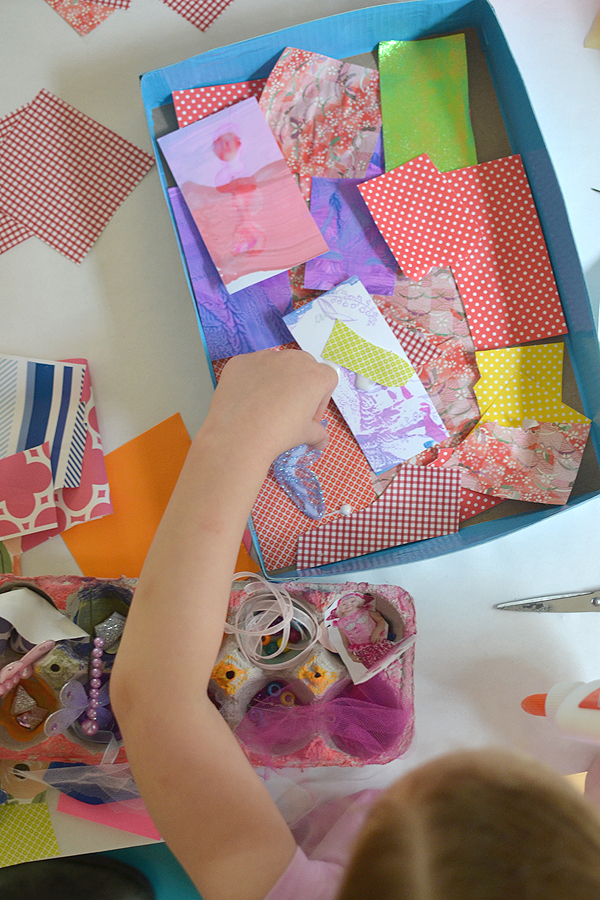 Children collect small things from their homes to make a collage.