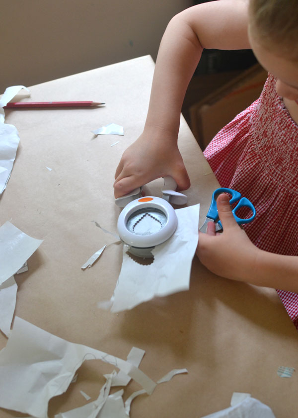 kids design and paint their own backpacks using freezer paper and a scrape painting technique