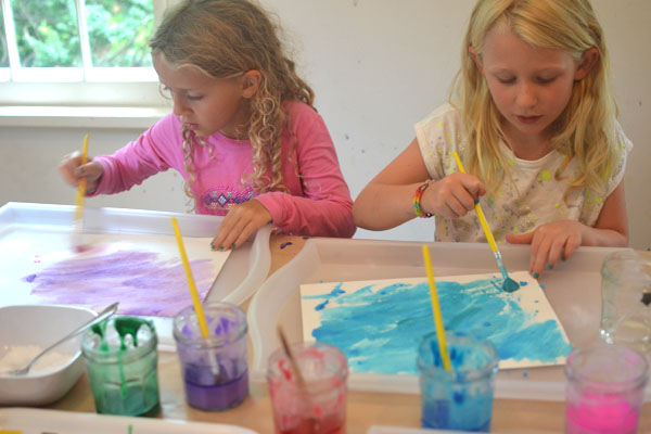 Kids paint with packing soda paint and vinegar to make fizzy works of art.