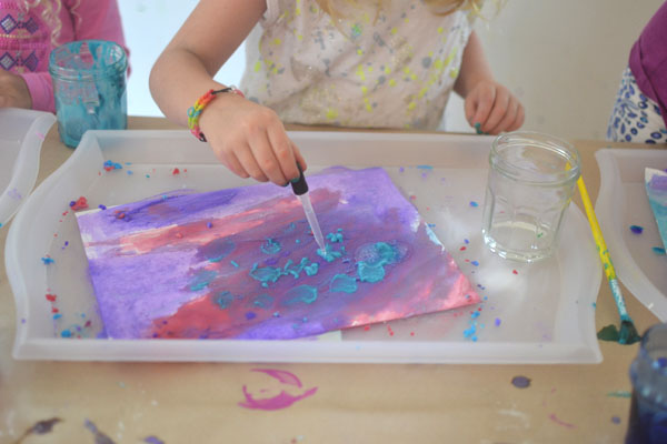 Kids paint with packing soda paint and vinegar to make fizzy works of art.