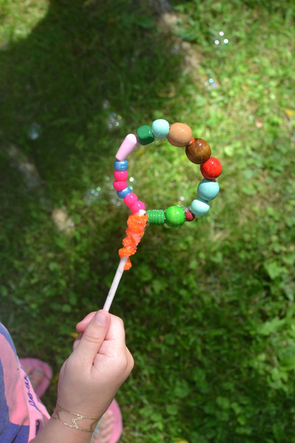 Kids make their own, homemade bubble wands with pipe cleaners and beads.