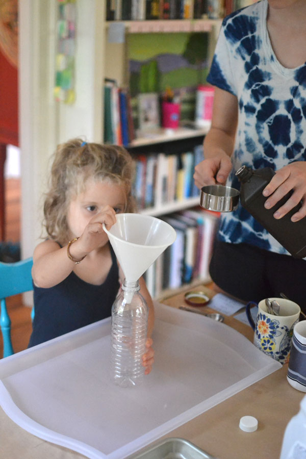 Kids make a fizzing science concoction called "Elephant's Toothpaste"