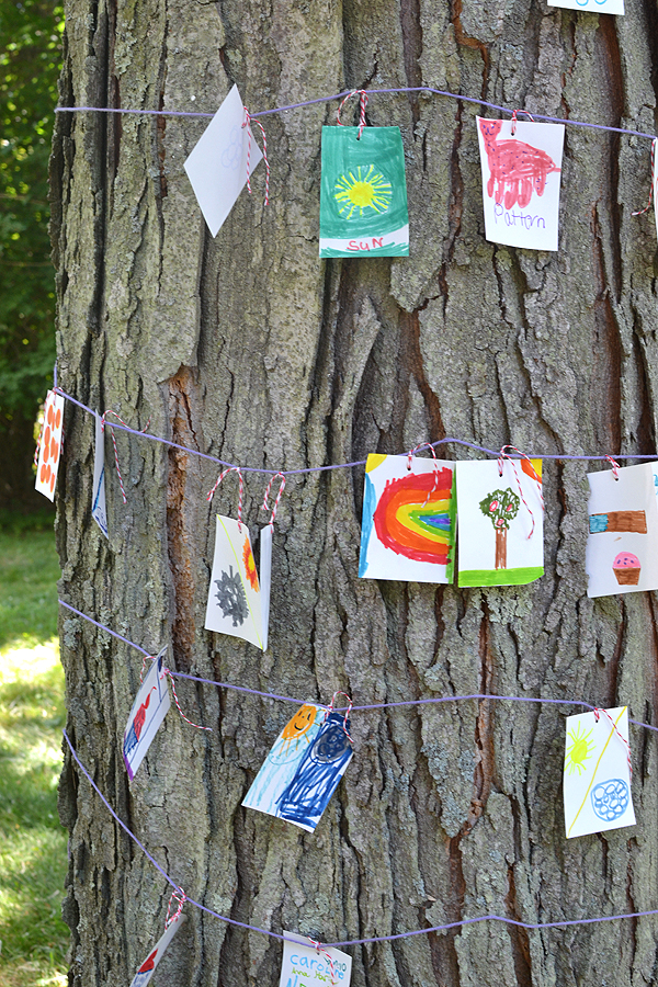 Set up an invitation to draw with a basket of drawing prompts, some paper, coloring markers, and a big old tree! A wonderful community project.
