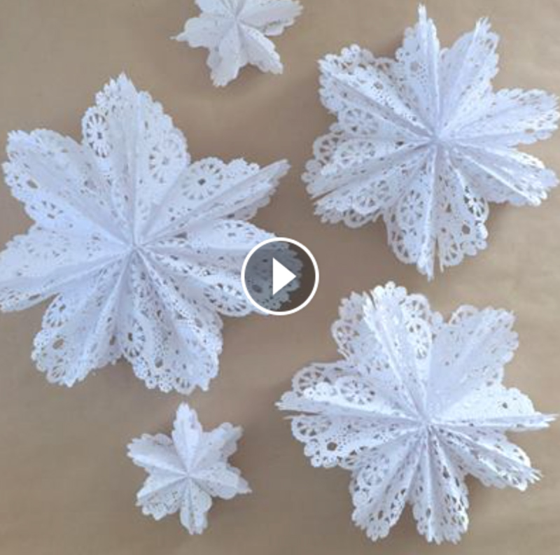 Video about how to make 3D snowflake stars from doilies and a gluestick.