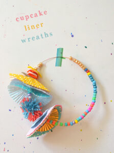 Kids make wreathes - or crowns - with wire, beads, and cupcake liners.