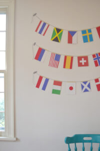 world flag garlands hanging on wall