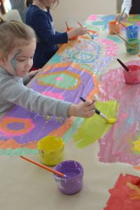 All you need is a roll of paper and some washable paint for this collaborative mural with kids!
