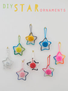 Kids make star ornaments with yarn and wire.