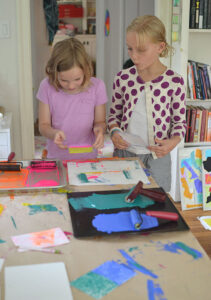 kids use styrofoam, tempera paint, and a brayer to make prints