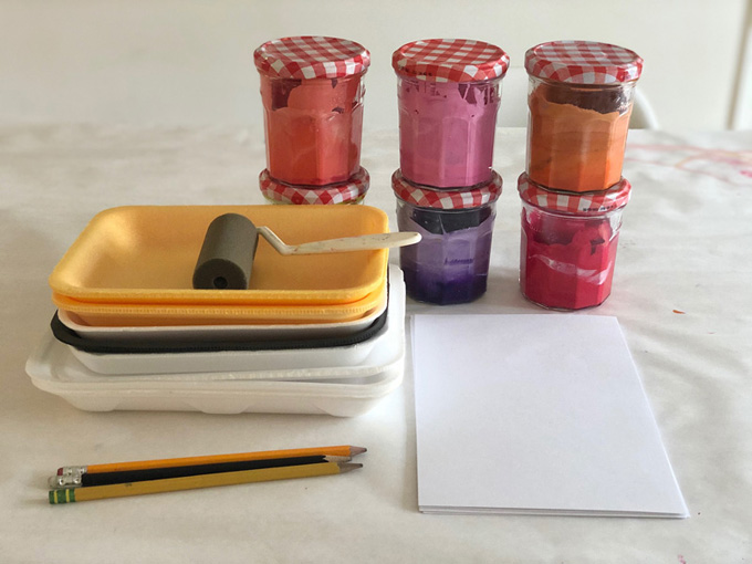 art supplies on the table, styrofoam, tempera paint, and rollers for printmaking
