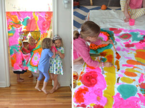 kids paint on fabric with liquid watercolor to make a no-sew puppet theatre