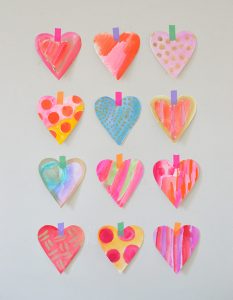 Simple technique to make a ton of watercolor hearts very quickly.