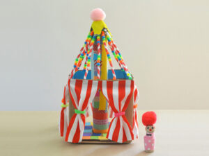 Finished circus tent craft for kids with little peg doll out in front