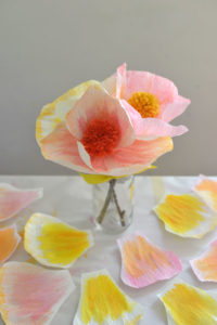 DIY handmade flowers with crepe paper and pom-poms