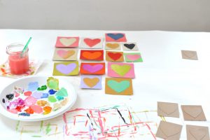 Make Valentines with cereal boxes, cutting out hearts and painting them with acrylics.