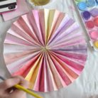 Paint handmade paper pinwheels with watercolors