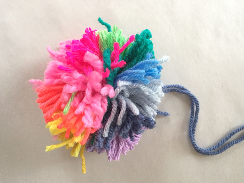 Make an (almost) perfect rainbow pom-pom with this simple DIY.
