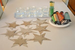 Glitter star mobiles made with cereal box cardboard.