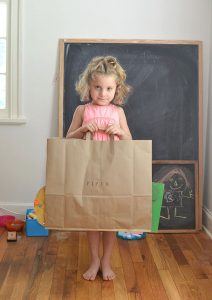 Make portfolios from paper bags to store your child's art.