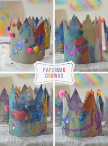 Children make crowns from paper grocery bags.