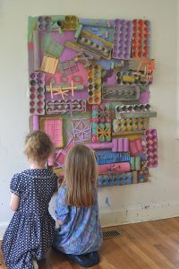 Using recycled materials, kids create a giant assemblage structure that they paint with colors they mixed themselves. Excellent process art experience.