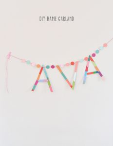 Make a name garland from paint chips and cardboard.
