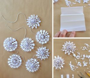 3D paper snowflakes made into a garland.