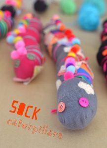 Kids make caterpillars from old socks.