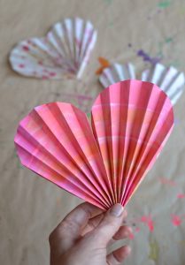 One-minute folded paper hearts. Make a garland, necklace, or fan. Or send in the mail for Valentine's Day!