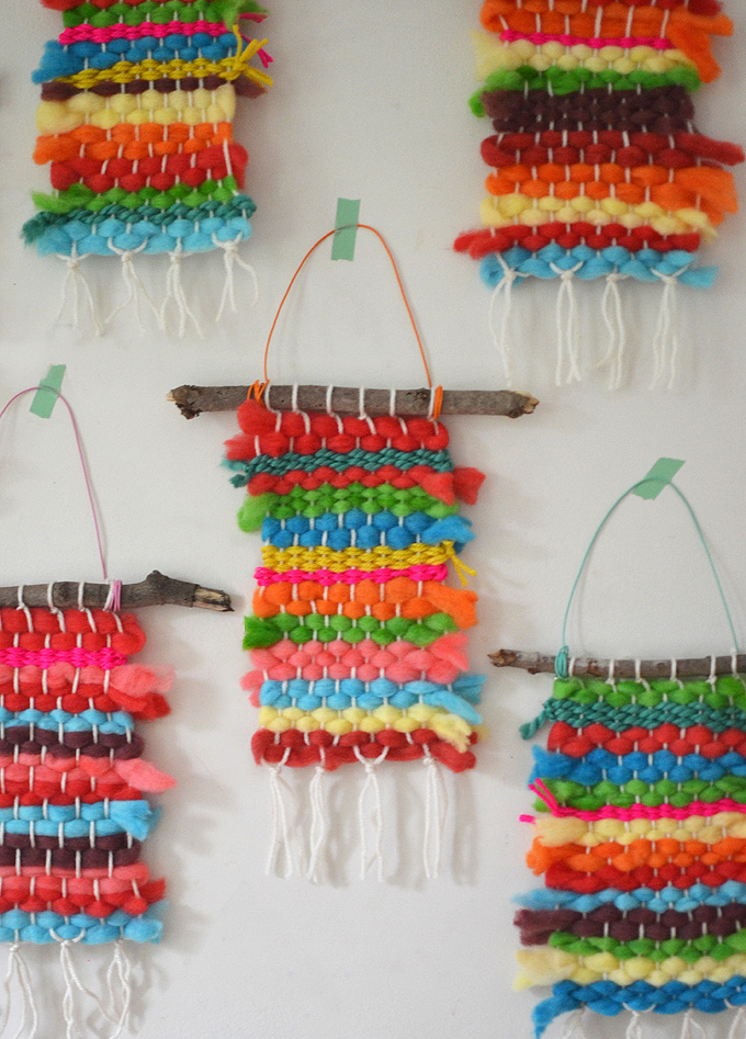 Kids dye their own chunky wool yarn with Koolaid, then make small weaving on cardboard looms.
