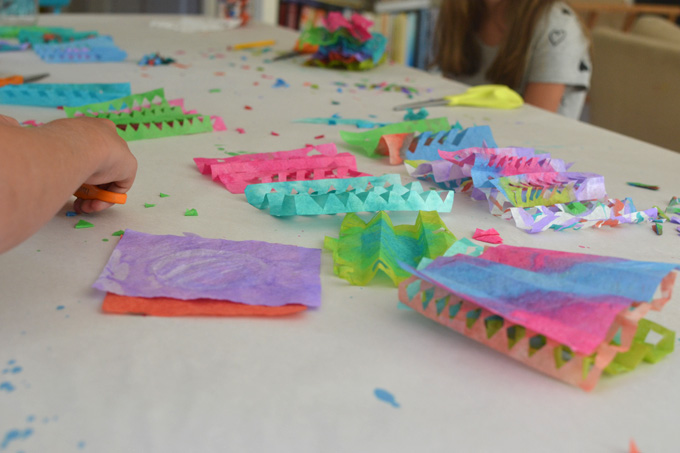 Kids paint and cut coffee filters to make this colorful Cinco de Mayo garland.
