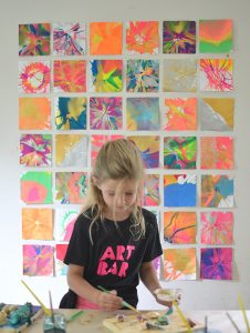 Make spin art with kids then hang them on the wall to make a really cool backdrop.