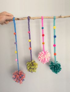 Make your own pom-pom loom from cardboard and follow this tutorial to create this charming mobile using easy supplies and simple skills.