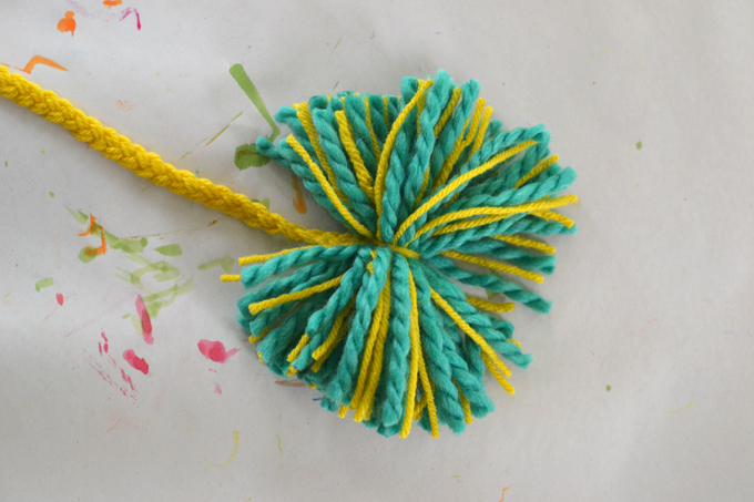 Make your own pom-pom loom from cardboard and follow this tutorial to create this charming mobile using easy supplies and simple skills.