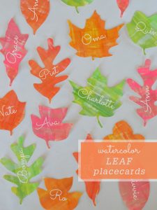 DIY leaf placecards for Thanksgiving made with watercolors and free printable stencils.