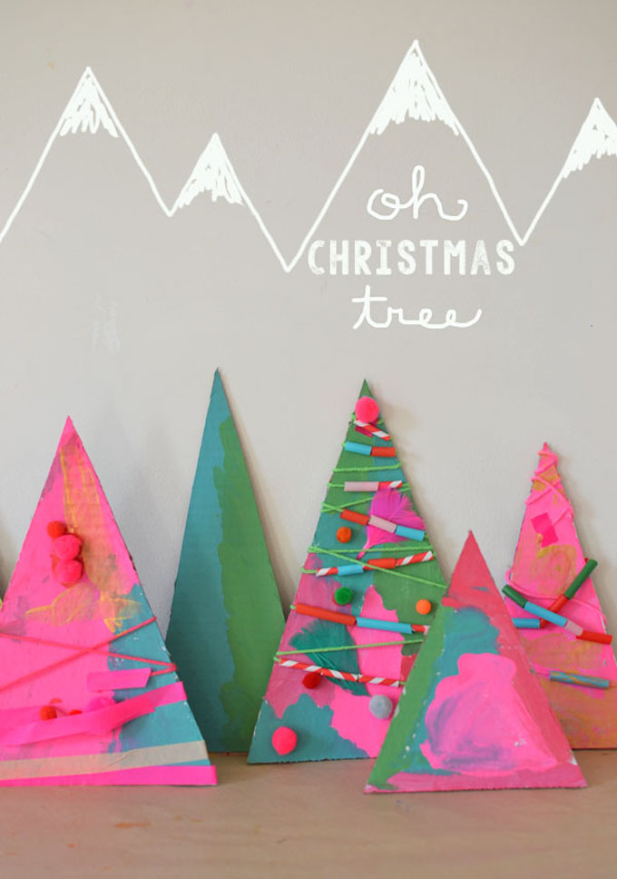 Children make process-art Christmas trees with paint and some collage materials.