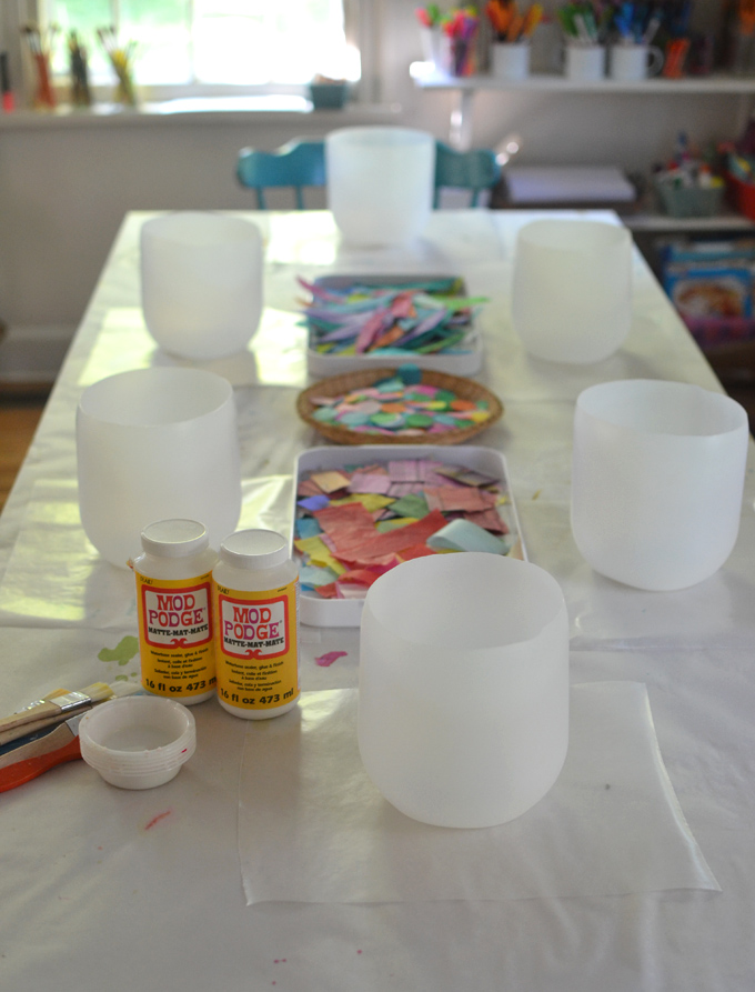 Kids make colorful lanterns from giant mayonnaise jars.