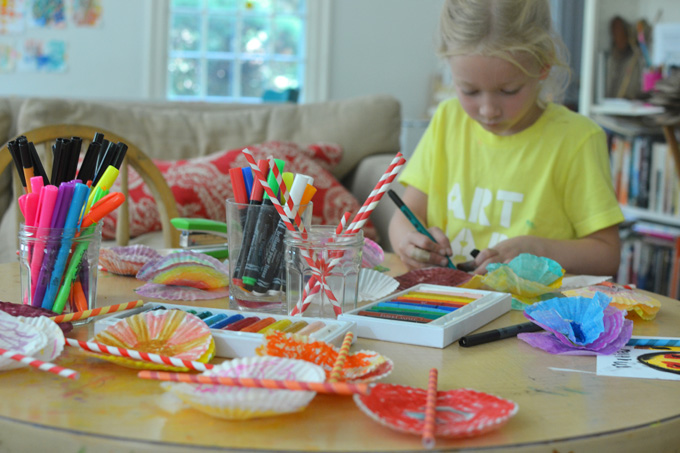A bouquet of flowers made with cupcake liners and paper straws. A wonderful open-ended art activity for all ages.