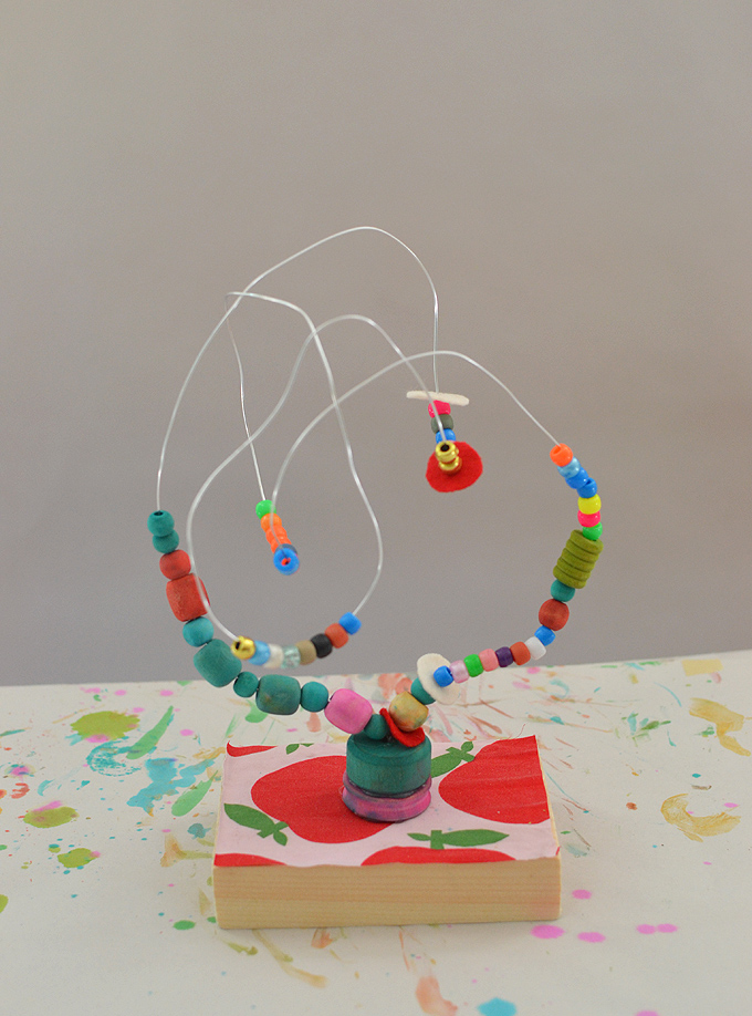Kids make colorful beaded wire maze sculptures, reminiscent of artist Alexander Calder's work. A wonderful handmade toy!