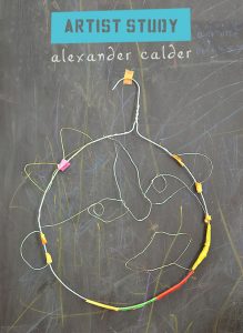 Kids study artist Alexander Calder and make wire faces.