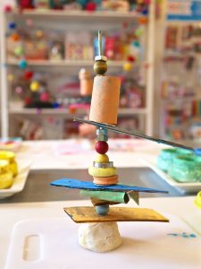 Kids use cardboard, beads, and clay to make stacked sculptures. A perfect process art experience that is great for toddlers through elementary age, and works both hand eye coordination and fine motor skills.